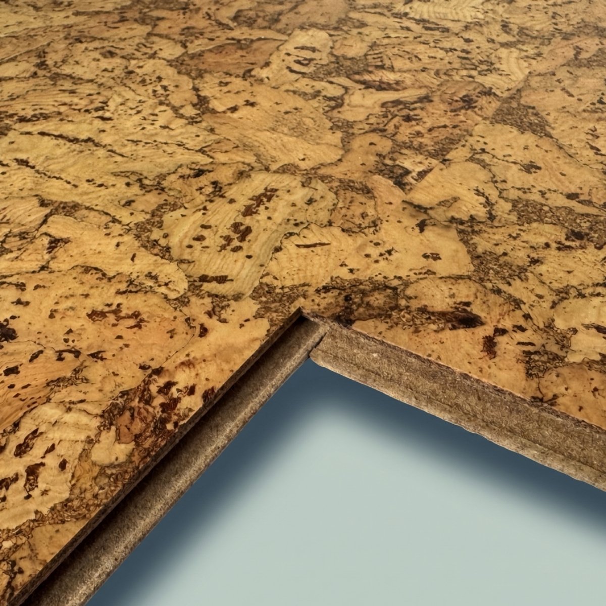 Close-up of cork flooring with a light blue gradient background
