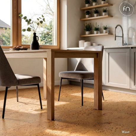 Modern kitchen with wooden dining table and chairs, cork flooring, natural light streaming in.